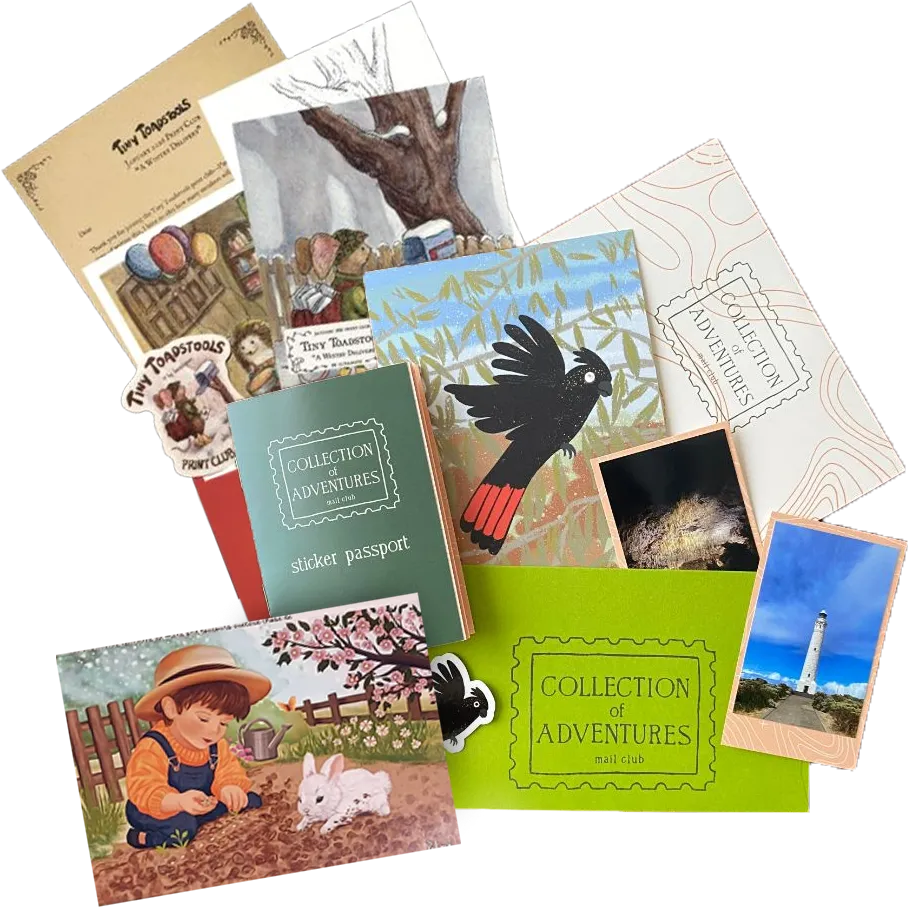 Monthly mail club box with postcards, stickers, and happy mail